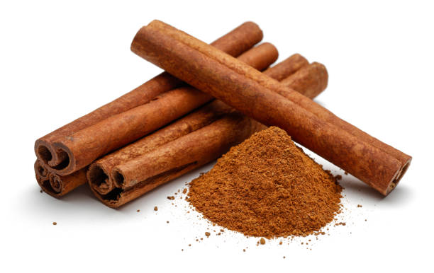 cinnamon sticks and powder isolated on white background